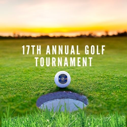 A golf ball sits near a hole on a green field at sunset, with the text "17th Annual Golf Tournament" displayed in bold white letters above.